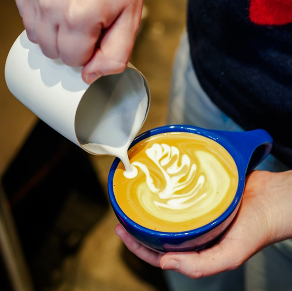 Coffee being poured into a cup